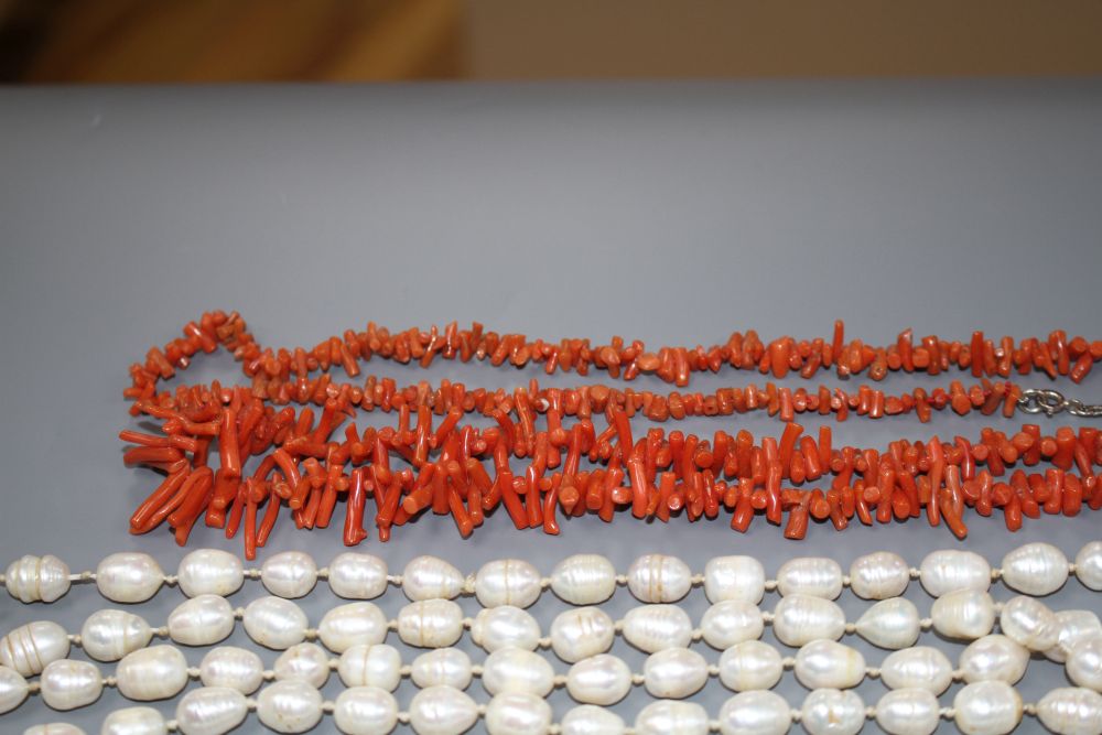 Two coral stick bead necklaces, a freshwater pearl necklace and three other costume necklaces,